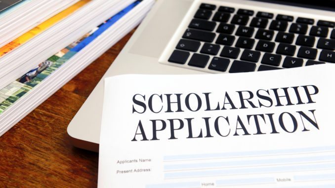 Laptop with paper scholarship application