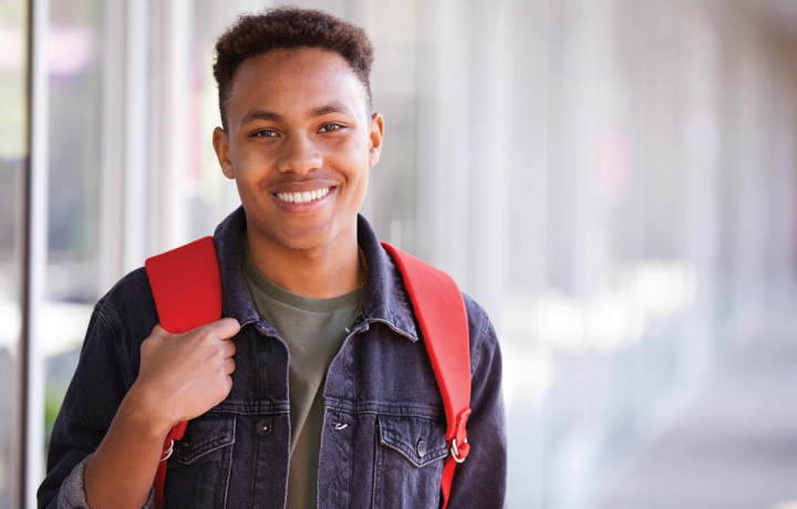 Student Smiling with Backpack
